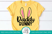 Load image into Gallery viewer, daddy bunny ears cut file displayed on a yellow t-shirt
